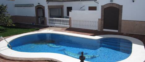 The pool and garden at the back of Casa Ventalarga