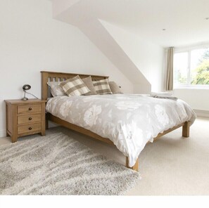 Main bedroom with king bed, desk and large new TV all usual steaming channels