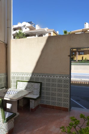 terrace in the back, with access to the road and swimming pool