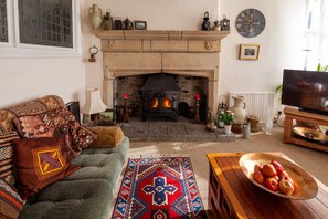 Living room with feature fireplace &
wood-burner