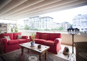 the 90 sqare meter terrace, with a living area and a dining area