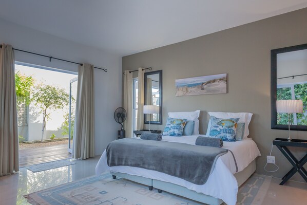 Main bedroom with double french doors to garden