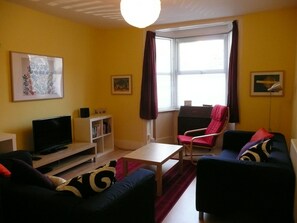Comfortable living room with TV, DVD, radio, etc.