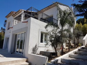 Back of the house with bedrooms leading to terrace and pool.