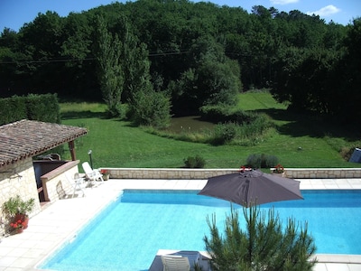 Restored house with private pool and views to the wooded hillside and small lake