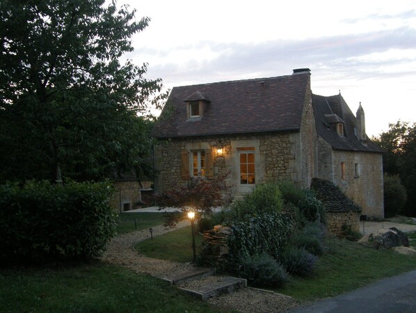 cottage  and garden at dusk