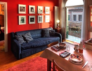 The living room with the blue sofa bed
