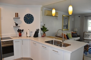 Fully fitted kitchen leading into the lounge