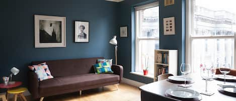 Two large original sash windows give a bright, airy feel to the living room