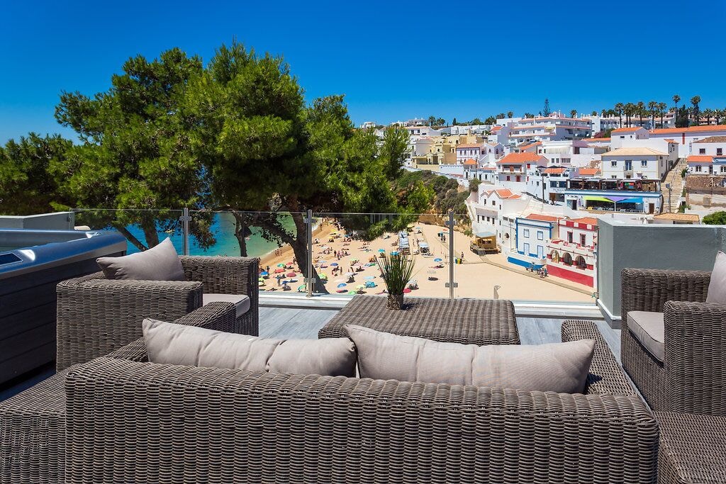 Outdoor sofa on a terrace overlooking Carvoeiro beach