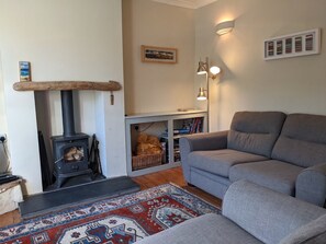 The cosy living room with log burner 
