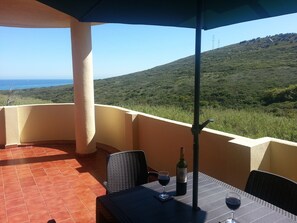 Terrace view of the sea and hillside, private.