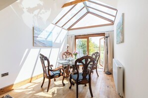 A sensational dining area opening out on to the terrace with views of the paddocks and at night views of a starry sky!