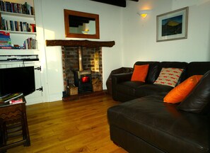 Cosy sitting room with logburner