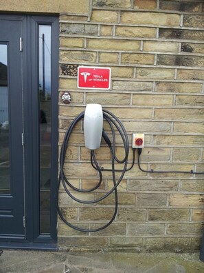 Electric vehicle charging included for guests