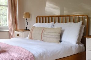 Cottages in the Walled Garden, Fring: Gardener's Cottage master bedroom with king size bed