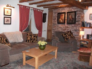 lounge with french door to balcony