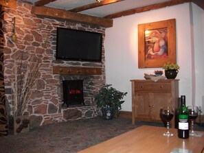 lounge with feature stone fireplace