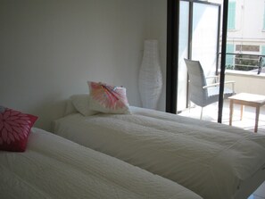 Bedroom with access to terrace with pool views