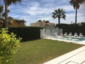 View of the garden and pool from the second terrace area