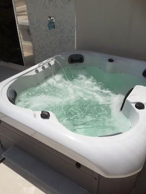 Our hot tub comfortably seats 5