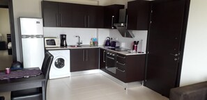 Kitchen includes cooker, hob, fridge freezer, microwave & washing machine