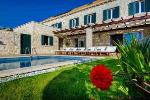 Terrace equipped with lounge chairs perfect for sunbathing and relaxing