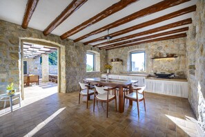 A rustic summer kitchen, outside dining and BBQ facilities are at your disposal