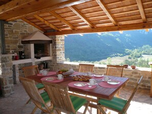 Covered outdoor kitchen with BBQ