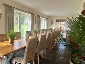 Lovely dining area to seat 18 overlooking the gardens with 3 pairs of french drs