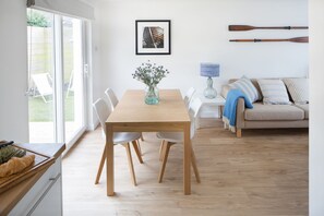 Dining in this sunny spot overlooking the south facing garden and deck.