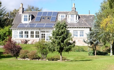 Wonderful spacious house and sun-porch in large garden facing south.