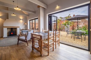 The Old Butcher's Stores, Heacham: Dining area has bi-fold doors to the courtyard garden