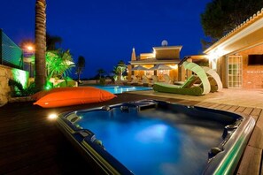 Night time jacuzzi and pool view