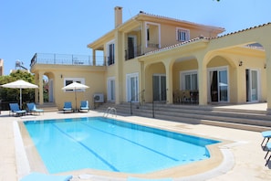 view of the villa and swimming pool