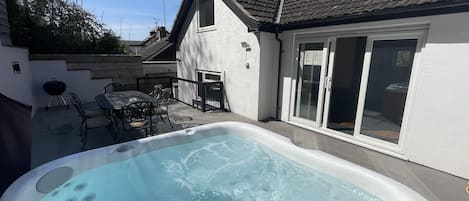 Rear patio with hot tub