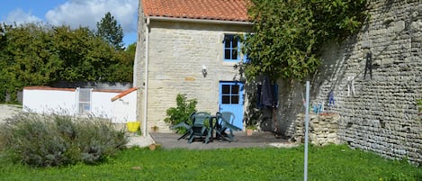 Cottage front view set in peaceful walled gardens