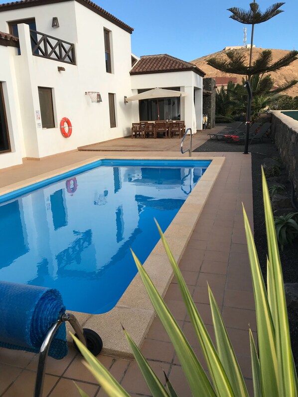 Heated pool with jets and solar heated shower