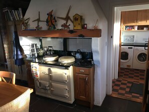 AGA cooker (electric) with Utility Room in the background.