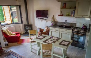 Open plan kitchen with wood burning stove