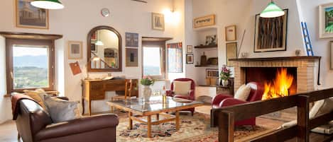 The living room with views out toward the valley and Spoleto