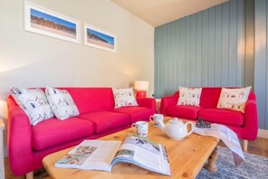 Ground floor: Sitting room with comfy sofas