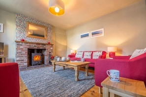 Mulberry Cottage, Wells-next-the-Sea: Sitting room with feature fireplace with wood burning stove