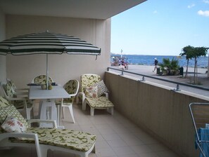 Large balcony, south facing to the beach and sea.