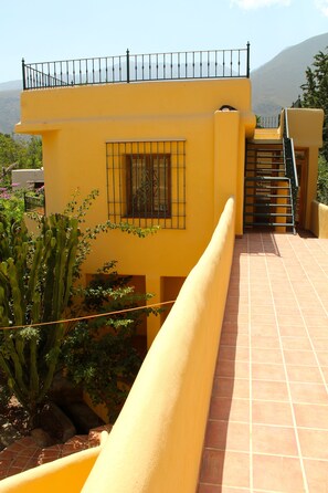 Steps to the roof terrace from above the Honesty Bar and Games Room