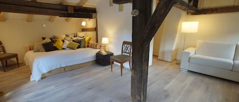 Living/Bedroom on the first floor with historic beams