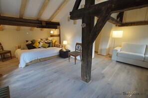 Living/Bedroom on the first floor with historic beams