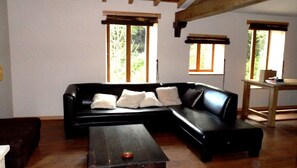 The living space (upstairs) leads to a shaded deck