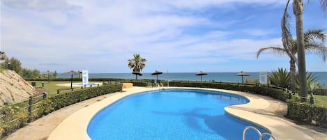 Beach side swimming pool in the urbanisation