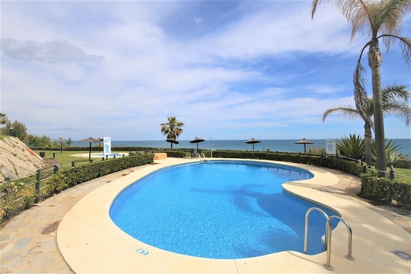 Beach side swimming pool in the urbanisation